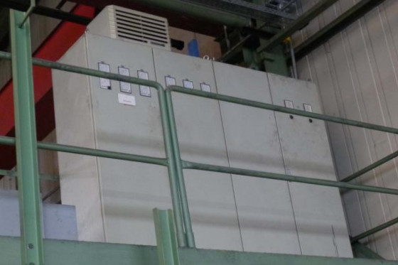 Travelling wheel roll grinder